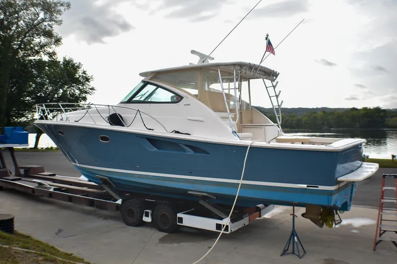 Fifth Case Yacht Photos Pics 2016 Tiara Yachts 4300 Open on trailer by waterfront, showcasing sleek design.