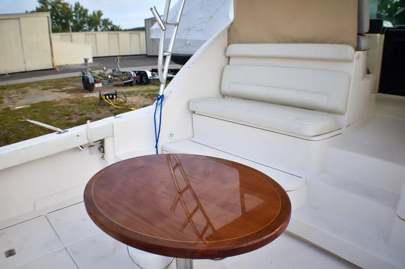 Fifth Case Yacht Photos Pics 2016 Tiara Yachts 4300 Open interior with wooden table and white seating.