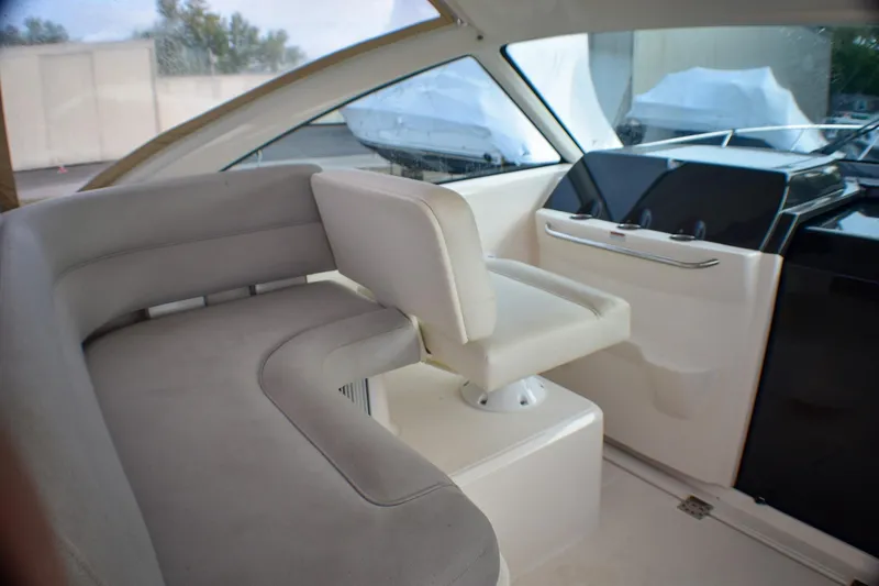 Fifth Case Yacht Photos Pics 2016 Tiara Yachts 4300 Open interior with white seating and helm station.