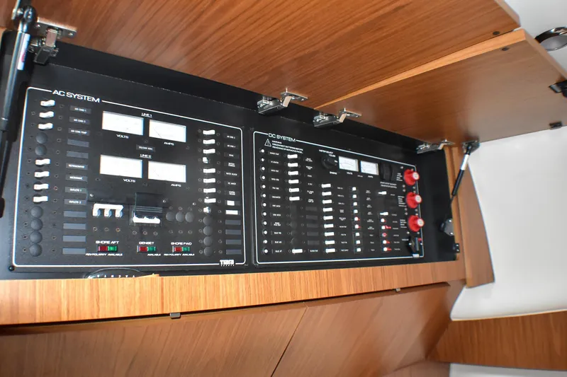 Fifth Case Yacht Photos Pics Electrical control panel on a 2016 Tiara Yachts 4300 Open, featuring AC and DC systems.
