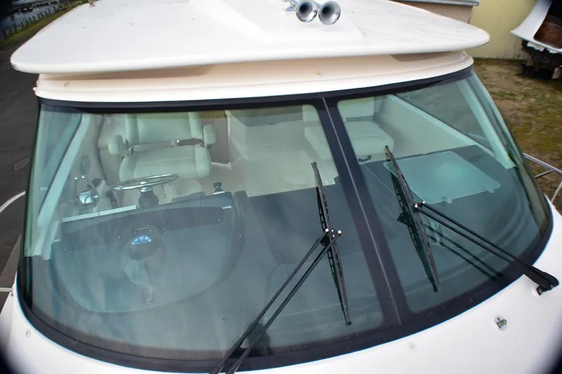 Fifth Case Yacht Photos Pics 2016 Tiara Yachts 4300 Open cockpit view with windshield wipers and steering wheel.