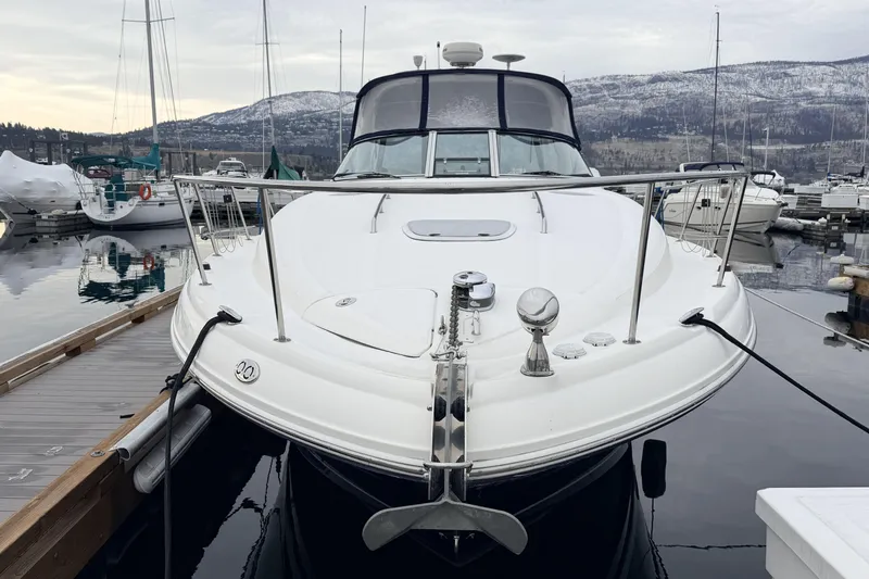  Yacht Photos Pics 2006 Sea Ray 340 Sundancer docked at marina with snowy mountains in background.