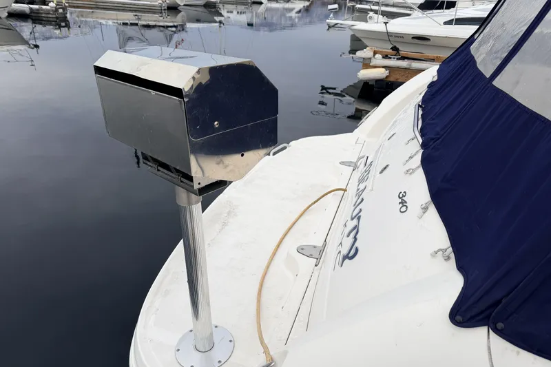  Yacht Photos Pics 2006 Sea Ray 340 Sundancer docked, featuring a metal grill on the deck.