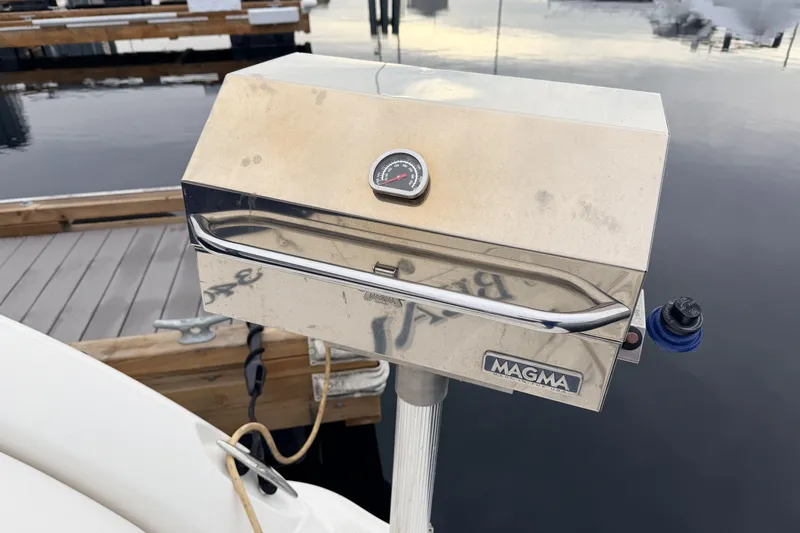  Yacht Photos Pics Stainless steel Magma grill on a 2006 Sea Ray 340 Sundancer boat docked by water.