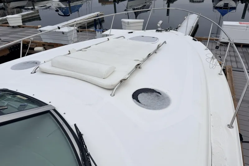  Yacht Photos Pics 2006 Sea Ray 340 Sundancer yacht docked at marina, showcasing sleek deck design.