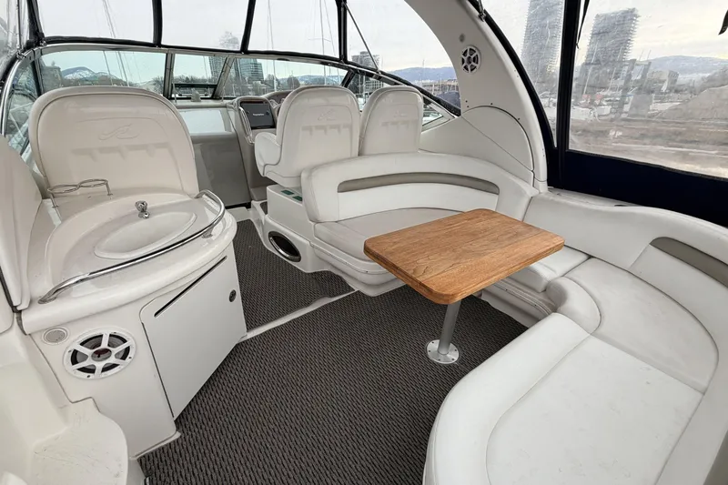  Yacht Photos Pics 2006 Sea Ray 340 Sundancer interior with seating, table, and sink.