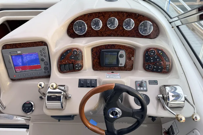  Yacht Photos Pics Control panel of a 2006 Sea Ray 340 Sundancer boat with navigation instruments.