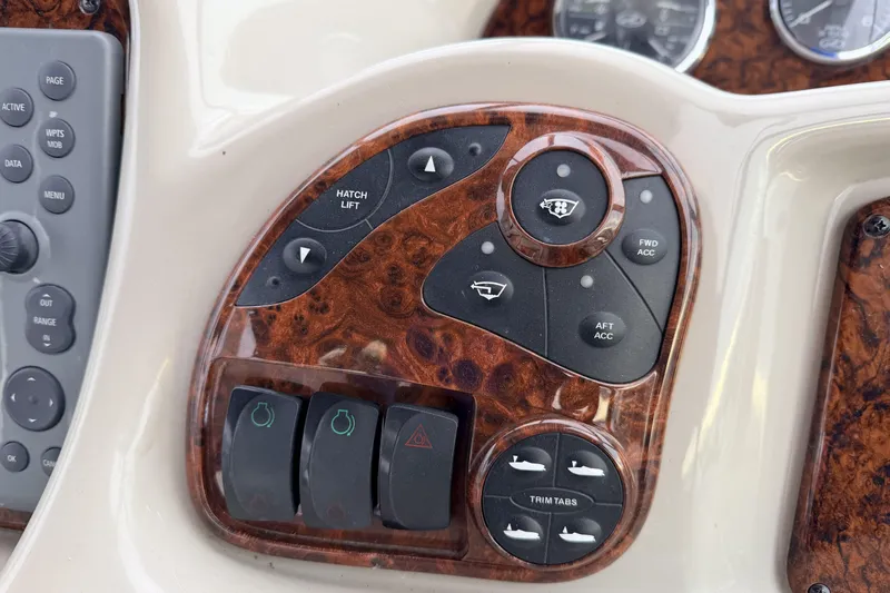  Yacht Photos Pics Control panel of a 2006 Sea Ray 340 Sundancer boat with wood finish.