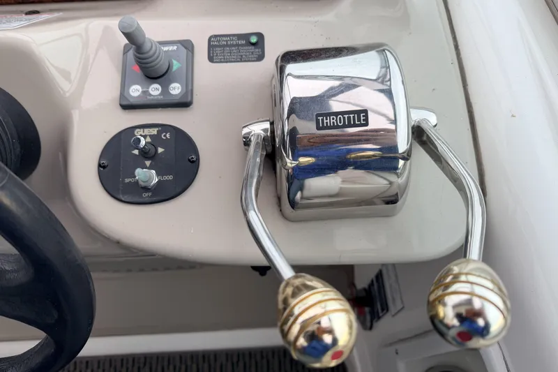  Yacht Photos Pics Throttle controls on a 2006 Sea Ray 340 Sundancer boat dashboard.