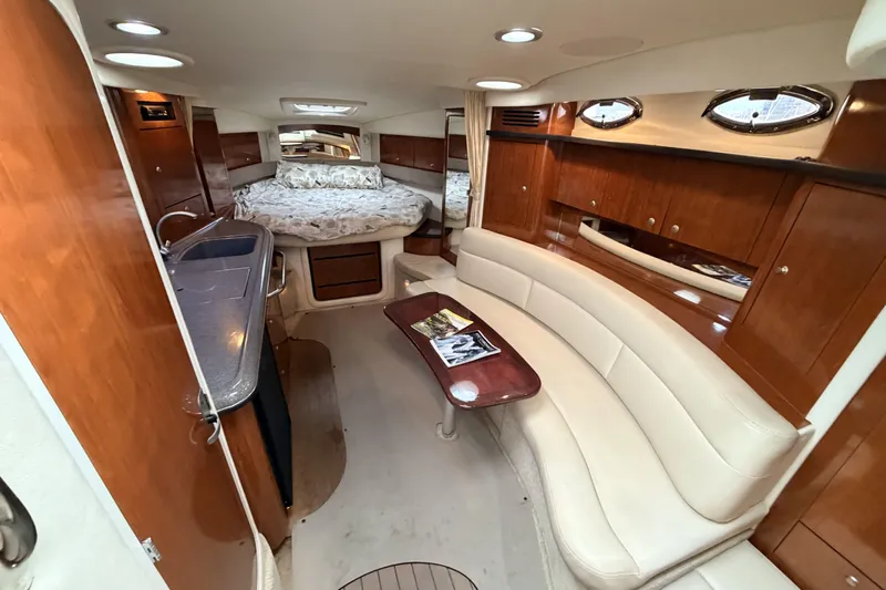  Yacht Photos Pics Luxurious interior of 2006 Sea Ray 340 Sundancer yacht with elegant wood and leather finishes.