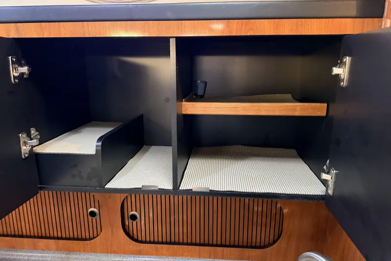  Yacht Photos Pics 2006 Sea Ray 340 Sundancer interior cabinet with shelves and storage space.