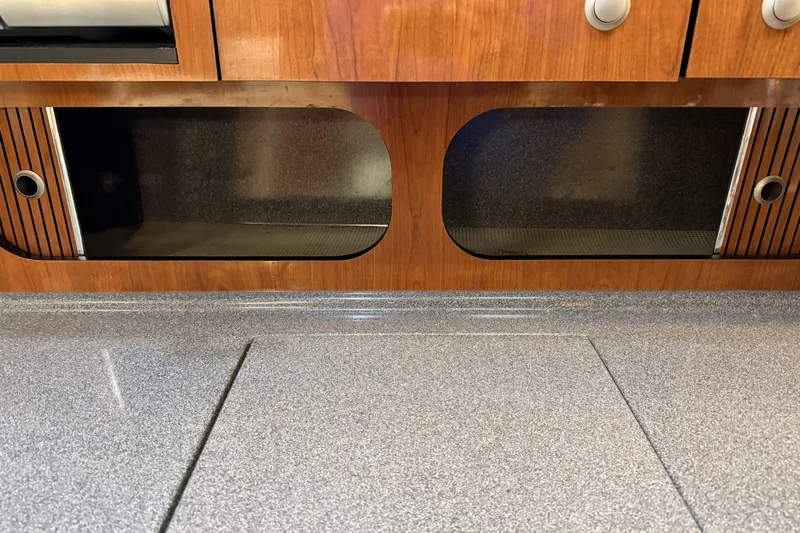  Yacht Photos Pics 2006 Sea Ray 340 Sundancer interior with wooden cabinetry and granite-style countertop.