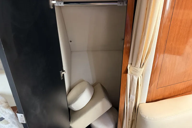  Yacht Photos Pics Open closet with cushions inside on a 2006 Sea Ray 340 Sundancer boat.