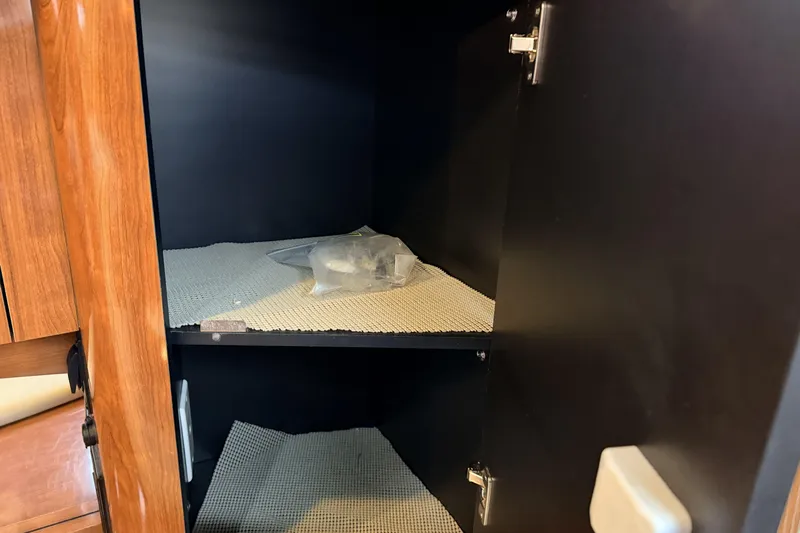  Yacht Photos Pics Empty cabinet interior on a 2006 Sea Ray 340 Sundancer boat.