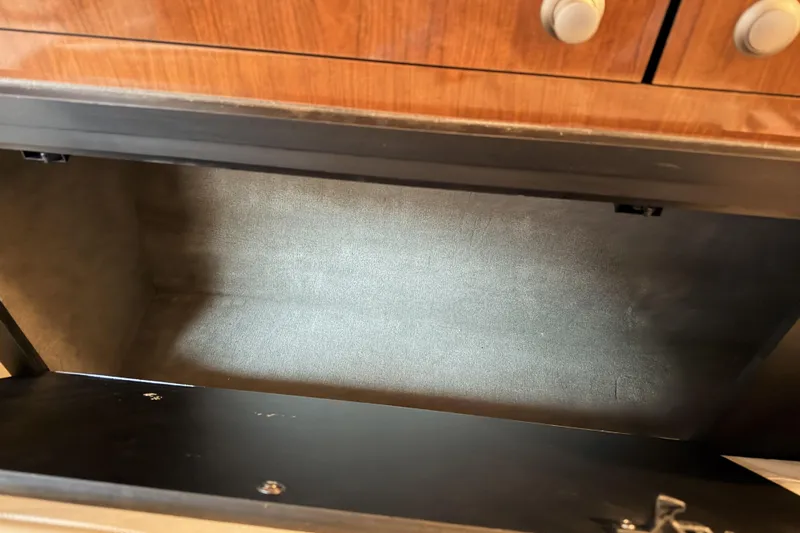  Yacht Photos Pics Open storage compartment in 2006 Sea Ray 340 Sundancer boat interior.