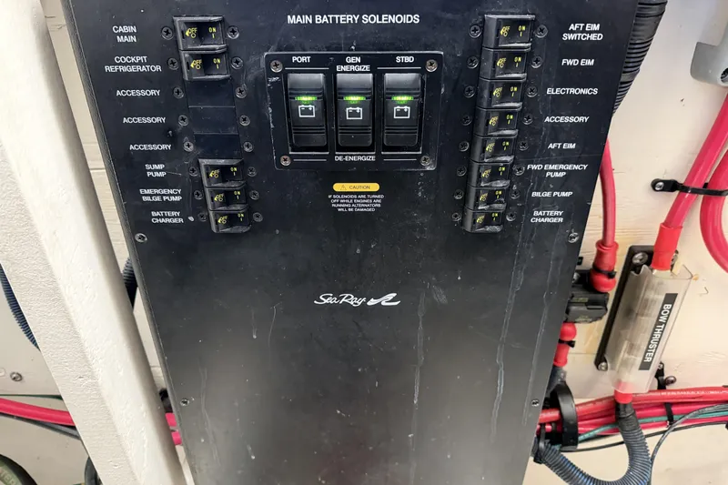  Yacht Photos Pics Control panel of a 2006 Sea Ray 340 Sundancer boat with labeled switches and solenoids.