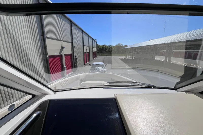  Yacht Photos Pics Interior view from a 2019 Regal 33 SAV boat, parked near storage units.