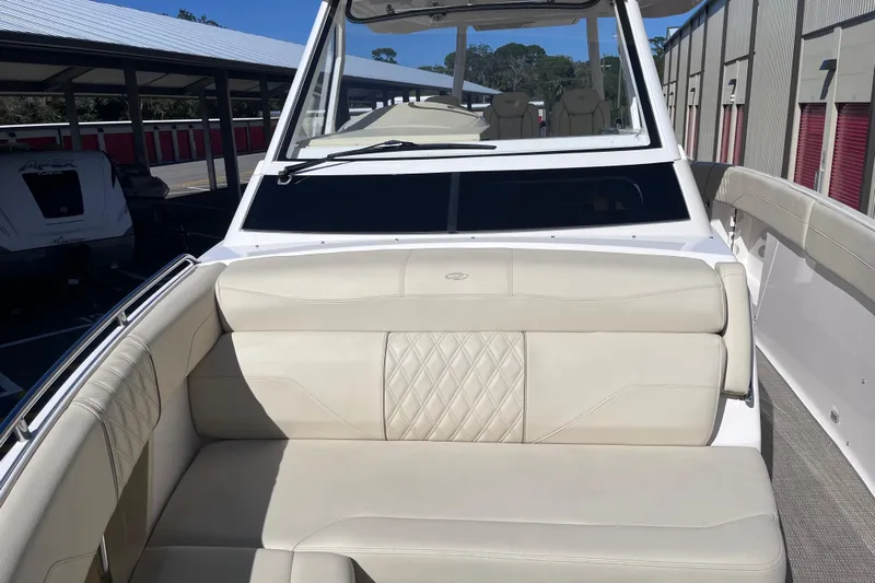  Yacht Photos Pics 2019 Regal 33 SAV boat with beige seating and sleek design.