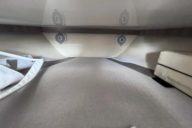  Yacht Photos Pics Interior cabin of 2019 Regal 33 SAV boat with speakers and seating.