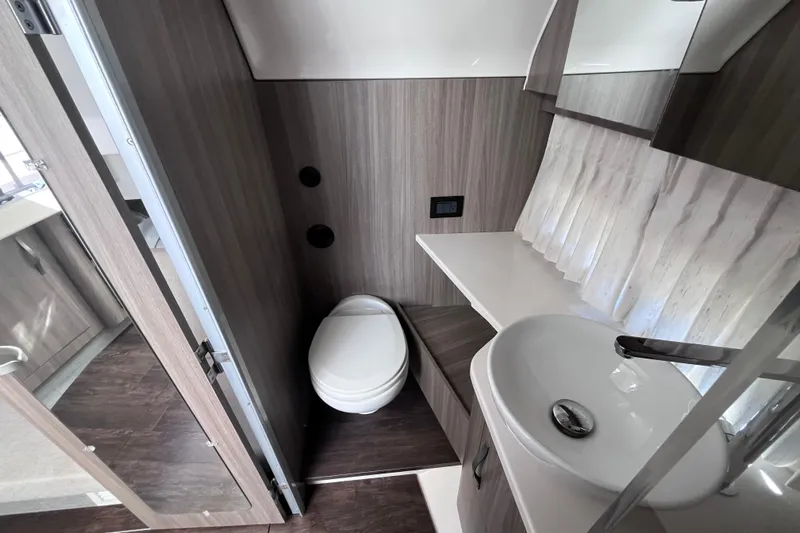  Yacht Photos Pics 2019 Regal 33 SAV boat bathroom with modern sink and toilet.