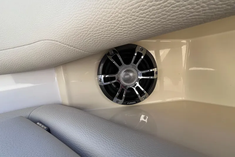  Yacht Photos Pics Speaker in 2019 Regal 33 SAV boat interior, featuring beige leather upholstery.