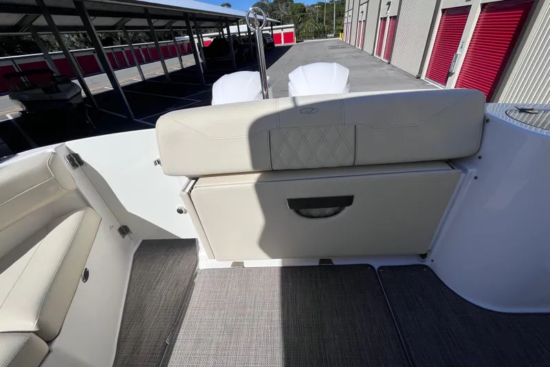  Yacht Photos Pics 2019 Regal 33 SAV boat interior with beige seating and storage compartment.