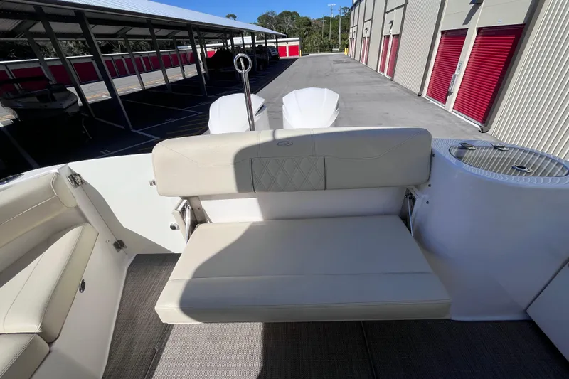  Yacht Photos Pics 2019 Regal 33 SAV boat interior with beige seating and storage area.
