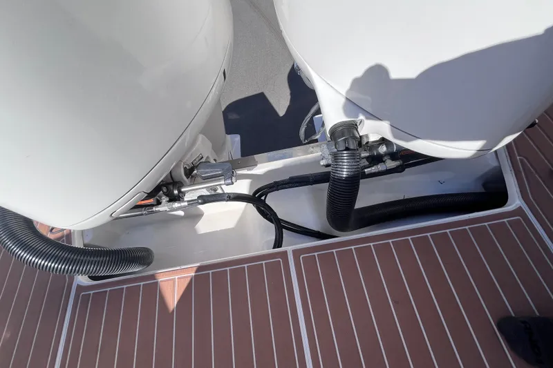  Yacht Photos Pics 2019 Regal 33 SAV boat engine compartment with visible hoses and connections.