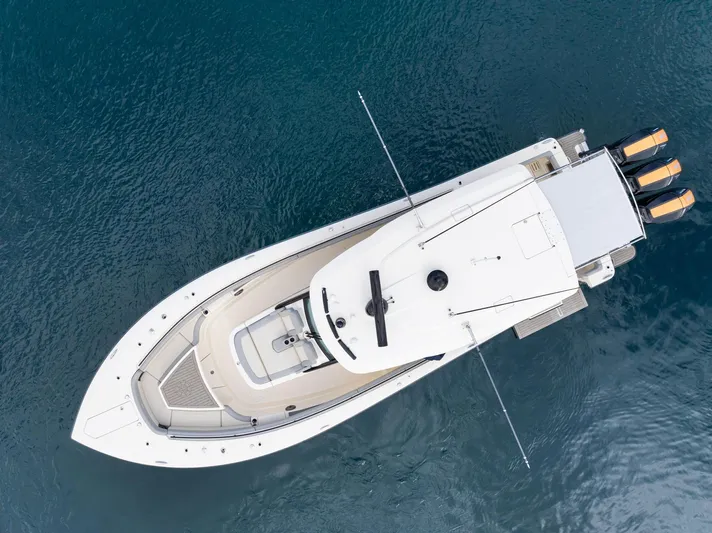  Yacht Photos Pics Aerial view of 2023 Scout 425 LXF luxury boat on clear blue water.