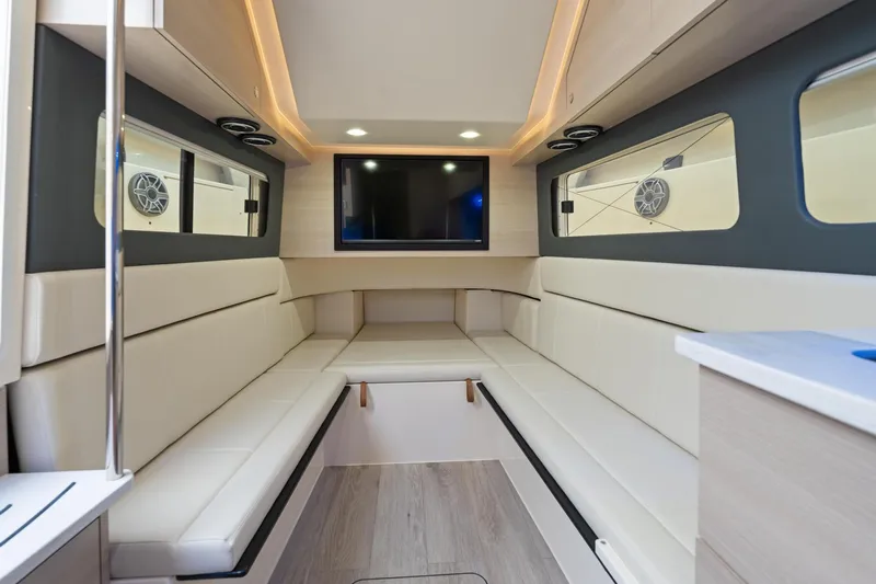  Yacht Photos Pics Luxurious interior of 2023 Scout 425 LXF boat with modern seating and entertainment system.