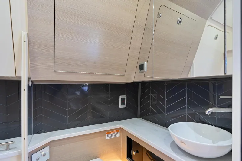  Yacht Photos Pics 2023 Scout 425 LXF interior with modern sink and sleek cabinetry design.