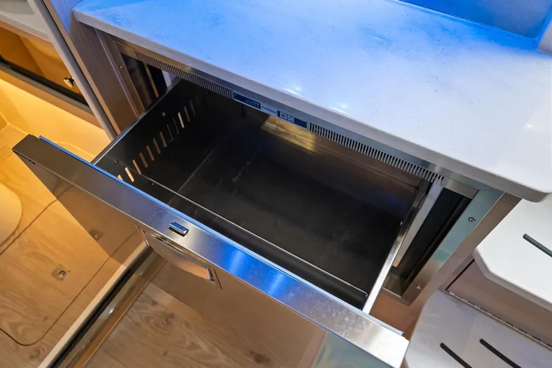  Yacht Photos Pics Open drawer in 2023 Scout 425 LXF boat interior, showcasing sleek design and functionality.