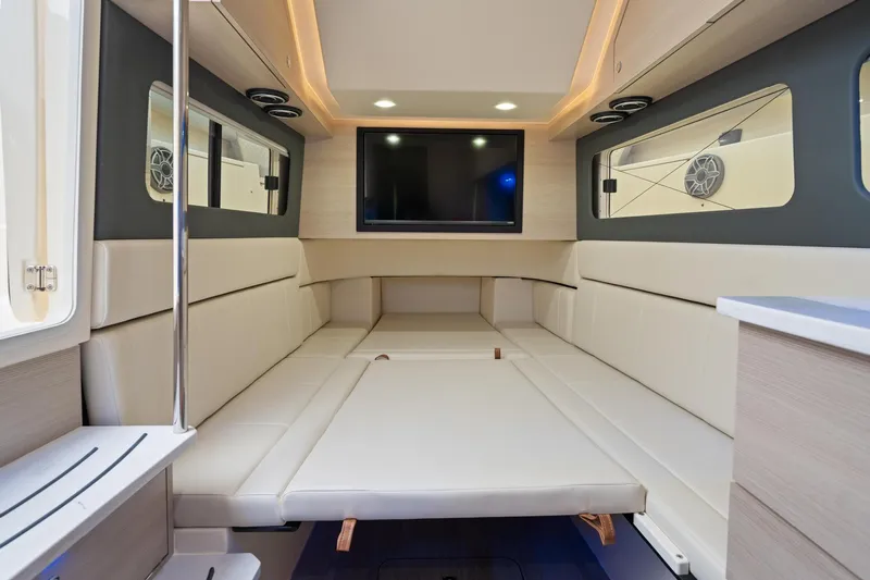 Yacht Photos Pics Luxurious interior of 2023 Scout 425 LXF boat with modern seating and entertainment system.