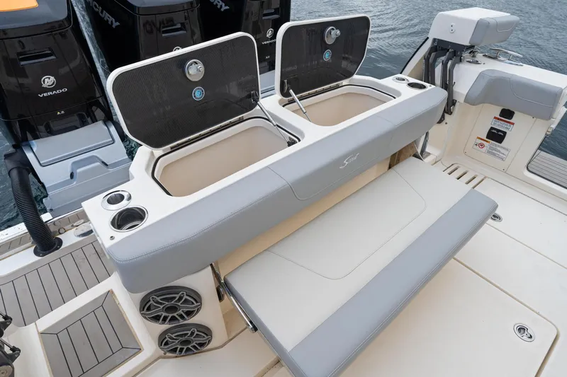  Yacht Photos Pics 2023 Scout 425 LXF boat with open storage compartments and seating area.