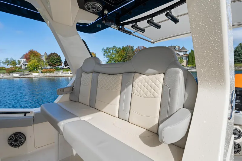  Yacht Photos Pics 2023 Scout 425 LXF boat interior with luxurious seating by the water.
