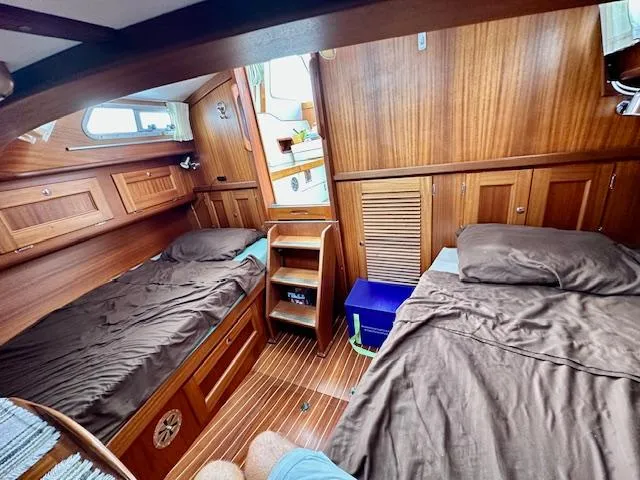  Yacht Photos Pics Cozy wooden cabin interior of 2002 Vilm 116 yacht with twin beds.