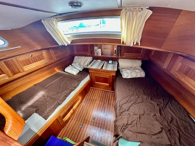  Yacht Photos Pics Cozy Vilm 116 yacht cabin interior with wooden finish, twin beds, and natural light.