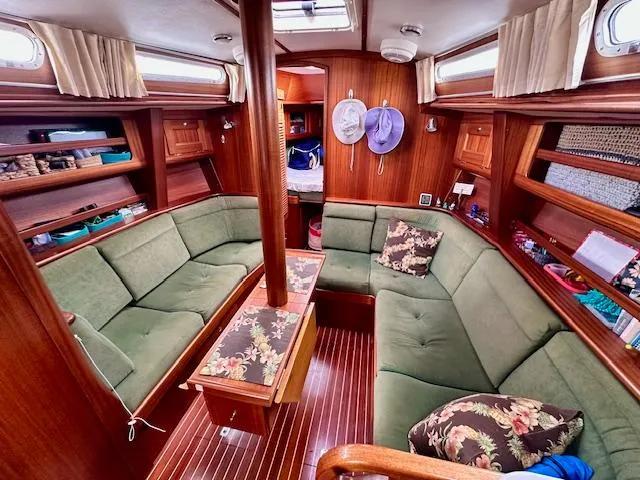  Yacht Photos Pics Cozy Vilm 116 yacht interior with green seating, wood paneling, and floral cushions, 2002 model.