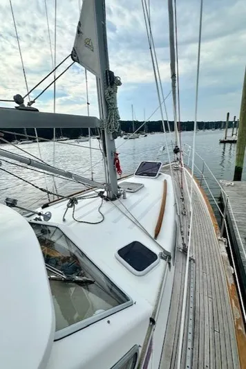  Yacht Photos Pics Sailboat Vilm 116, 2002 model, docked at marina with cloudy sky.