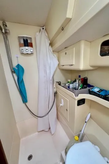  Yacht Photos Pics Compact bathroom in 2002 Vilm 116 yacht with shower and storage.