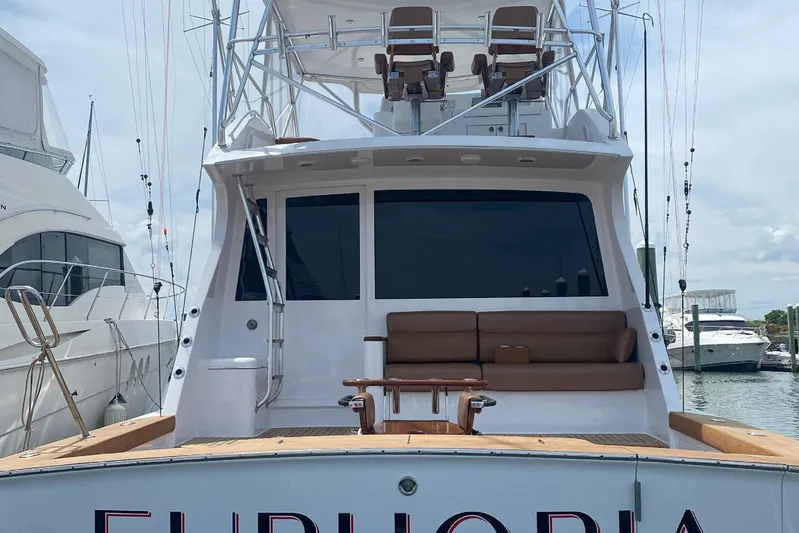 Euphoria Yacht Photos Pics 2000 Custom Carolina Precision Sportfish boat docked, featuring spacious seating and fishing equipment.