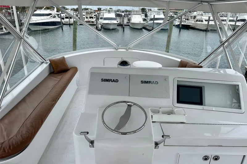 Euphoria Yacht Photos Pics 2000 Custom Carolina Precision Sportfish helm with Simrad electronics, docked at marina.