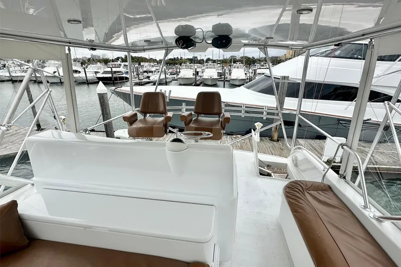 Euphoria Yacht Photos Pics Custom Carolina Precision Sportfish 2000 boat interior with leather seating and marina view.