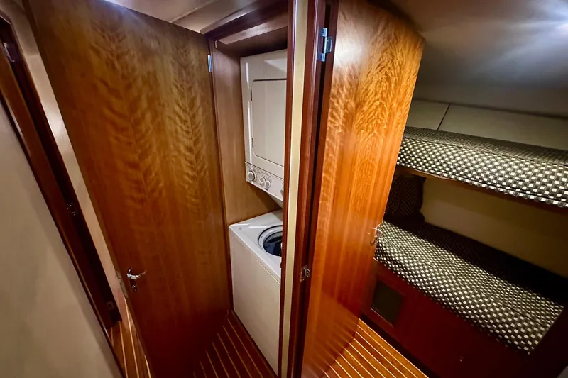 Euphoria Yacht Photos Pics Laundry area and bunk beds in 2000 Custom Carolina Precision Sportfish yacht interior.