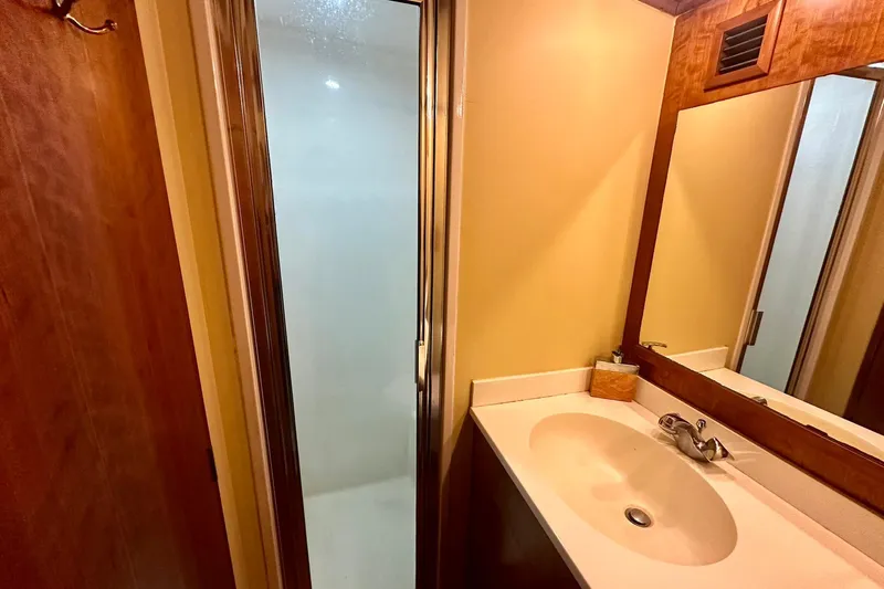 Euphoria Yacht Photos Pics Bathroom interior of 2000 Custom Carolina Precision Sportfish with shower and sink.