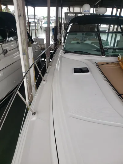 Escondite Yacht Photos Pics 2001 Sea Ray 410 Sundancer docked in a marina, showcasing sleek design and spacious deck.