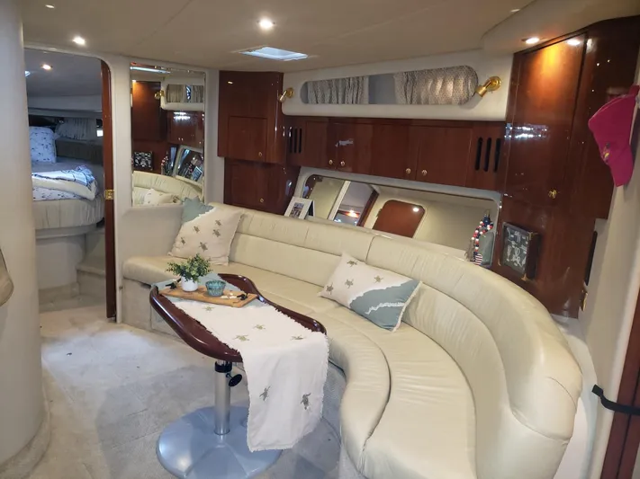 Escondite Yacht Photos Pics Luxurious interior of 2001 Sea Ray 410 Sundancer yacht with elegant seating and decor.