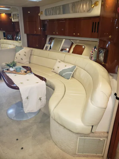 Escondite Yacht Photos Pics Luxurious interior of 2001 Sea Ray 410 Sundancer yacht with elegant curved seating.