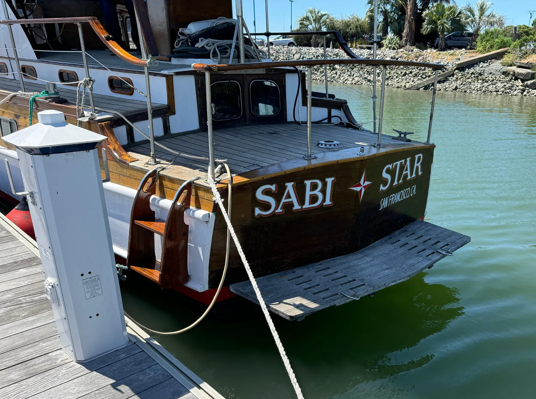Classic 1966 Rampart 48 yacht "Sabi Star" docked at marina.