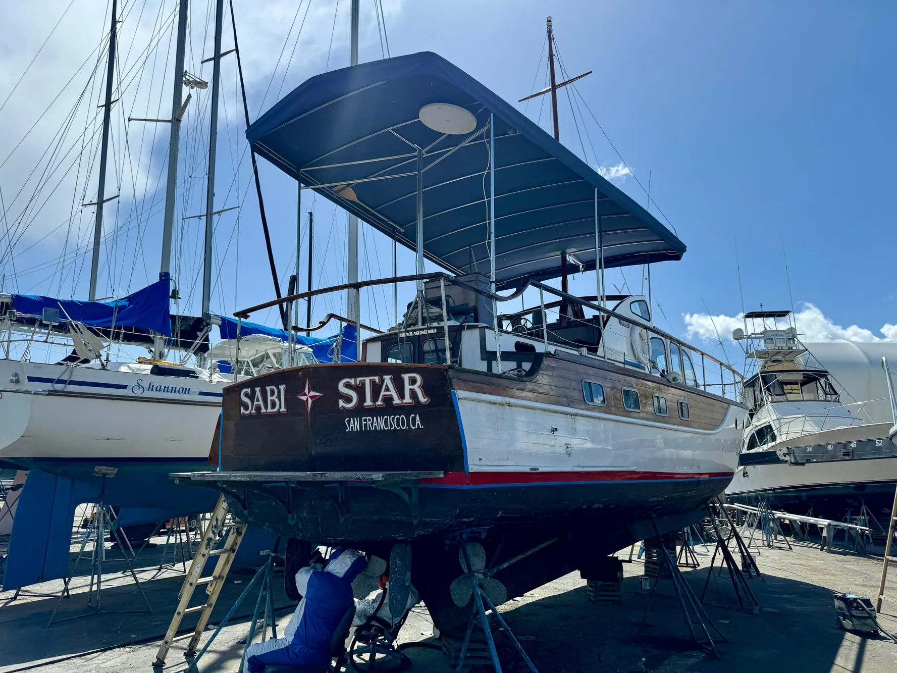 1966 Rampart 48 boat named "Sabi Star" in a marina, San Francisco, CA.